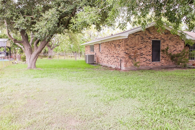 view of yard featuring central AC unit