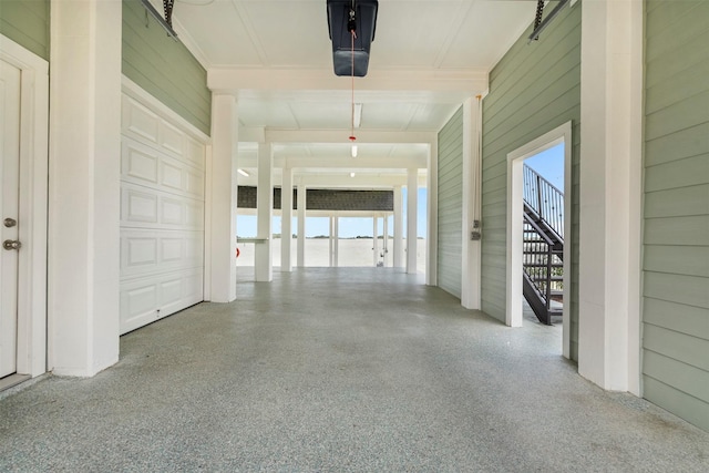 hall with speckled floor and wood walls