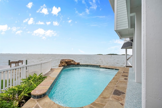 view of pool featuring a water view and a patio area