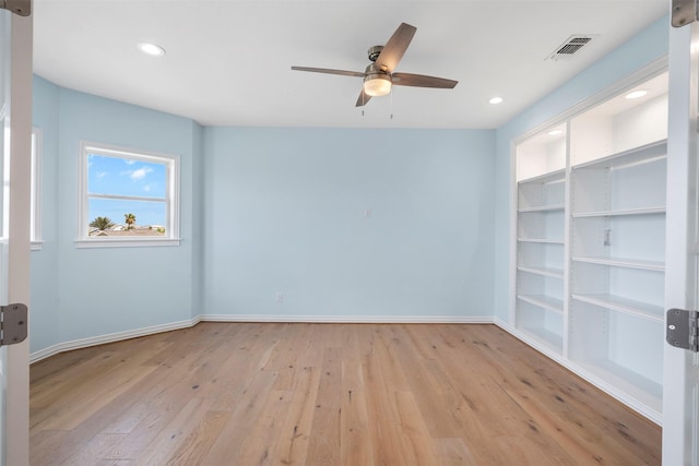 empty room featuring baseboards, visible vents, ceiling fan, light wood-style floors, and recessed lighting