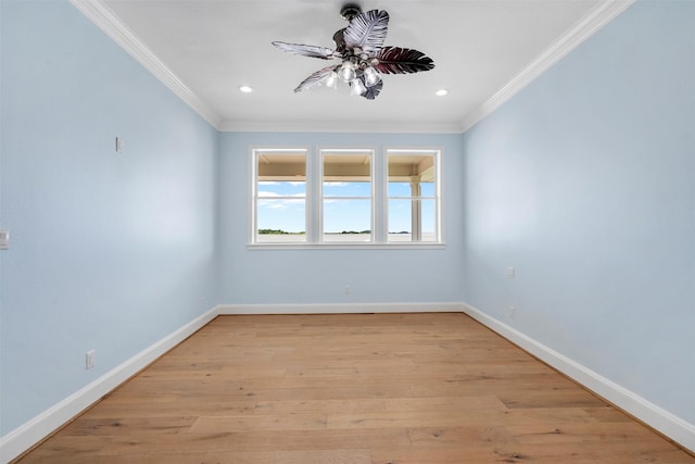 unfurnished room featuring light wood-type flooring, baseboards, and ornamental molding