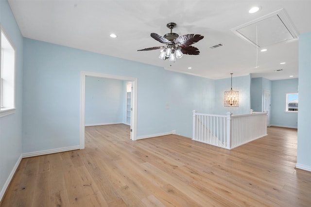 empty room featuring attic access, recessed lighting, visible vents, and light wood-style flooring