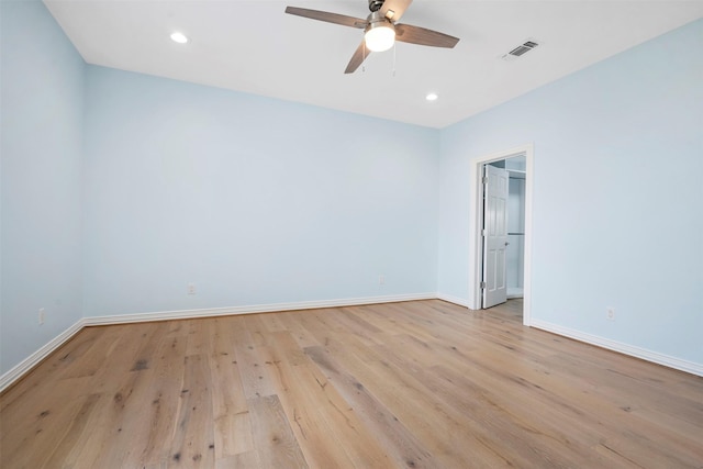 spare room with recessed lighting, light wood-style flooring, and baseboards