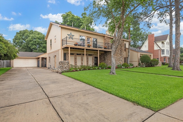 view of front of house featuring a garage and a front lawn