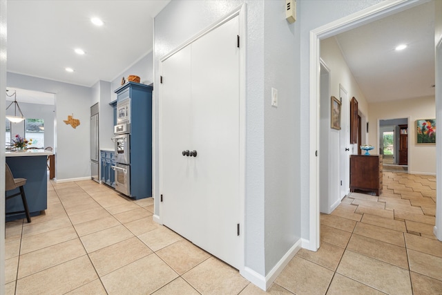 corridor with light tile floors