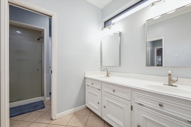 bathroom featuring double vanity, an enclosed shower, and tile floors