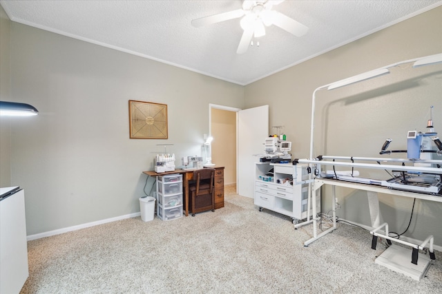 home office with light carpet, ceiling fan, and a textured ceiling