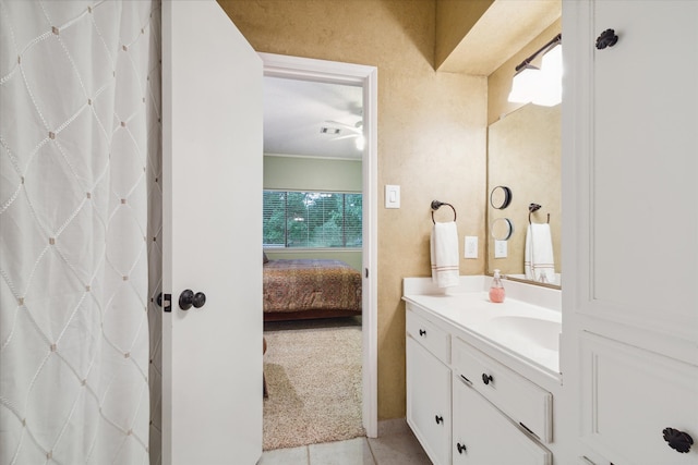 bathroom featuring tile flooring and vanity