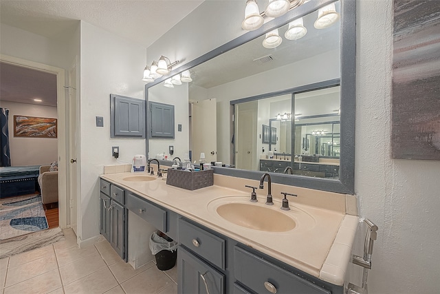 bathroom featuring dual bowl vanity and tile flooring