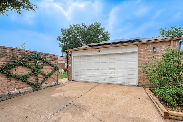 garage featuring solar panels