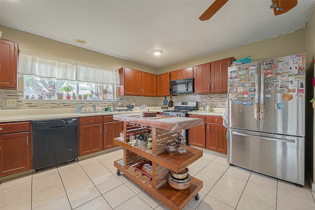 kitchen featuring ceiling fan, backsplash, black appliances, and light tile floors