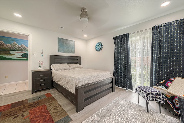 tiled bedroom with ceiling fan