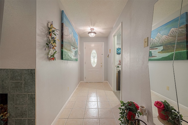 interior space with light tile floors and a textured ceiling