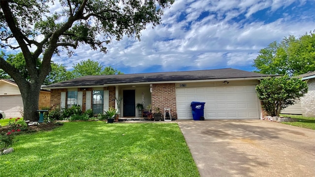 single story home featuring a garage and a front yard