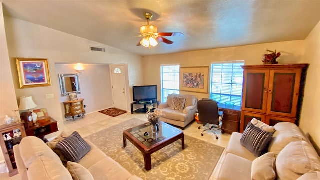 living room with tile flooring, lofted ceiling, and ceiling fan