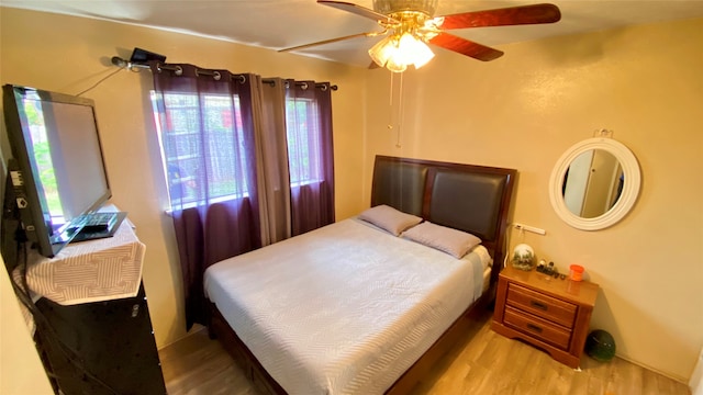 bedroom featuring ceiling fan and wood-type flooring