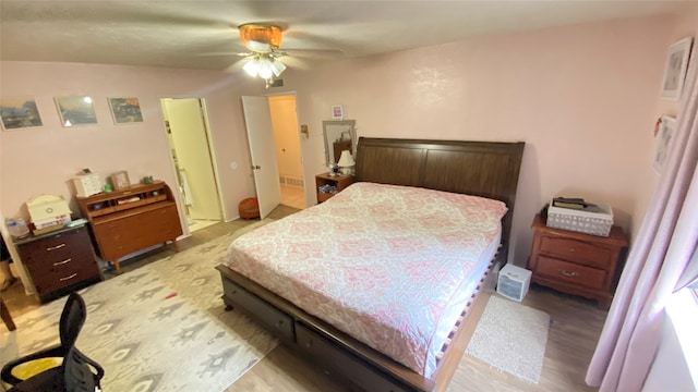 bedroom featuring hardwood / wood-style floors and ceiling fan