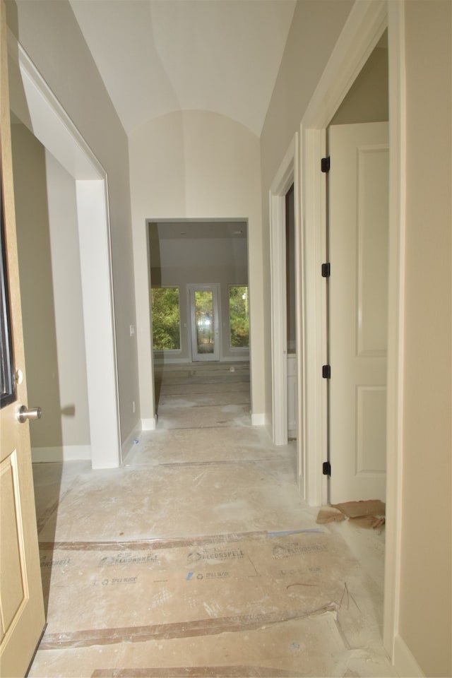 corridor featuring vaulted ceiling