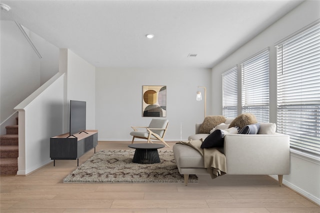 living room with light hardwood / wood-style flooring