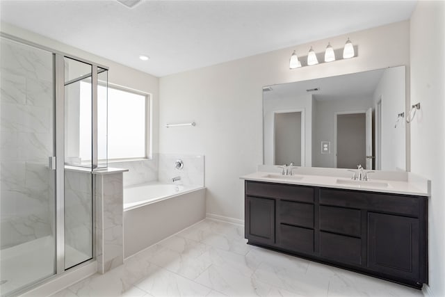 bathroom featuring vanity and shower with separate bathtub