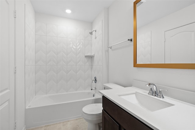 full bathroom with toilet, vanity, tiled shower / bath, and tile patterned floors