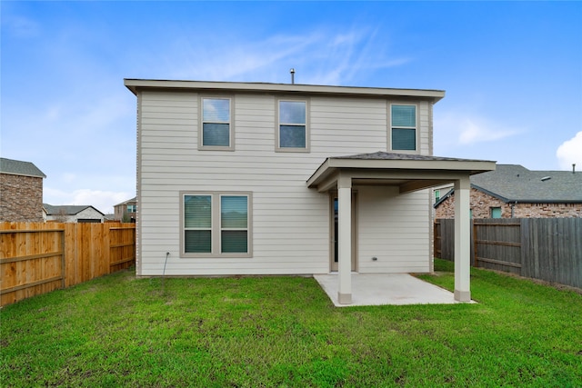 rear view of property with a patio area and a yard