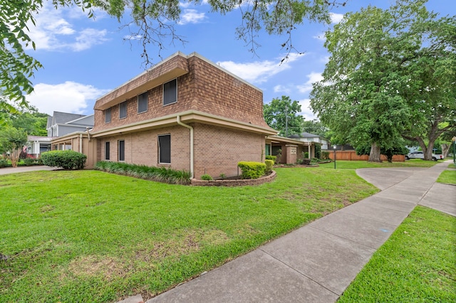 view of property exterior with a yard