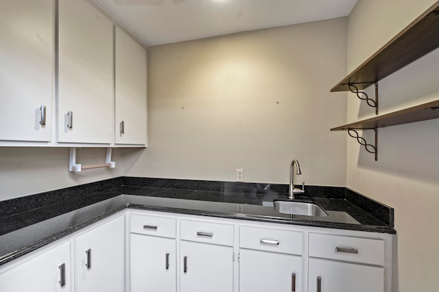 kitchen with white cabinetry and sink