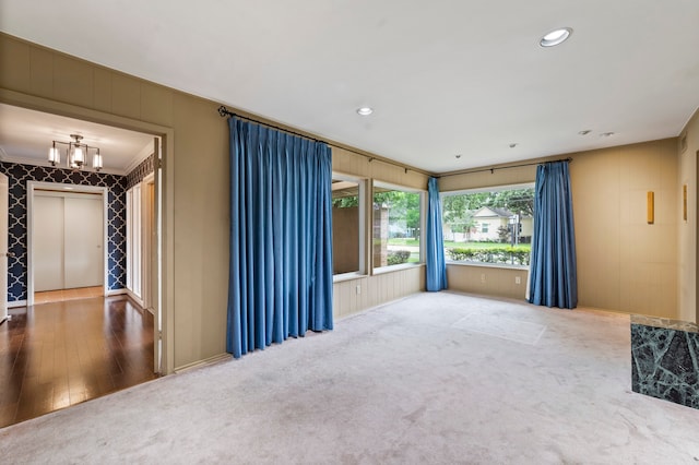 carpeted empty room featuring ornamental molding