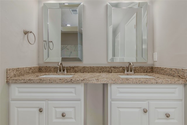 bathroom featuring dual vanity