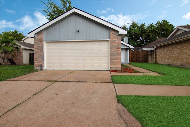 view of front of home with a garage and a front yard