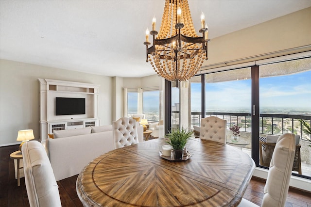 dining space with a chandelier and wood-type flooring