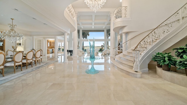 entryway with coffered ceiling, stairway, an inviting chandelier, a high ceiling, and beam ceiling