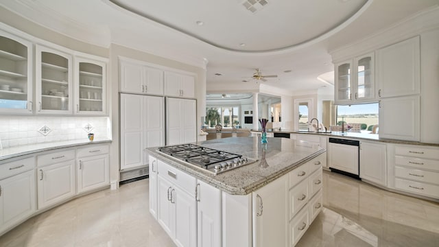 kitchen with white cabinetry, glass insert cabinets, dishwasher, and a center island