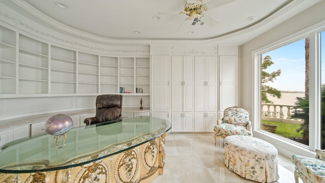 office space with built in shelves and crown molding