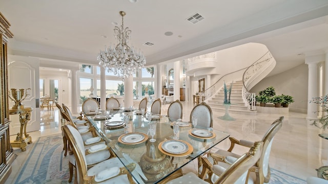 dining area with stairway, decorative columns, visible vents, and an inviting chandelier