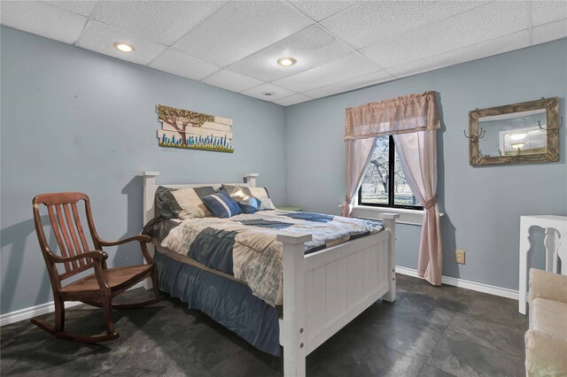 tiled bedroom with a drop ceiling