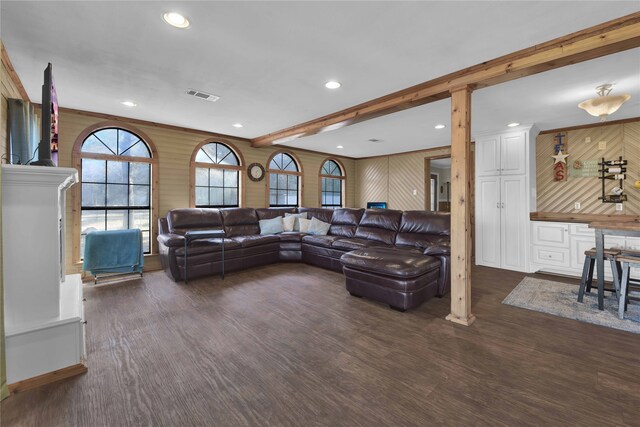 living room with ornamental molding, dark wood-type flooring, and ornate columns