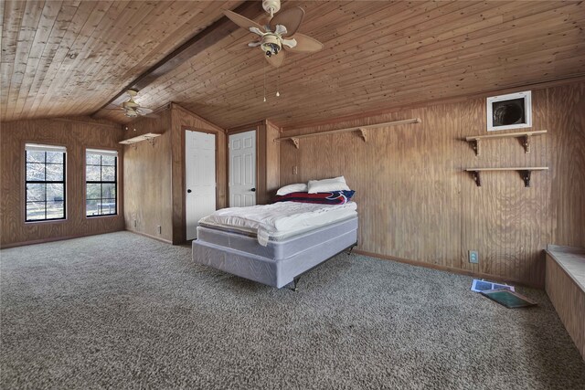 unfurnished bedroom with wooden ceiling, carpet flooring, and wooden walls