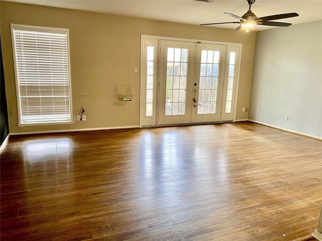 unfurnished room featuring ceiling fan, french doors, and wood-type flooring