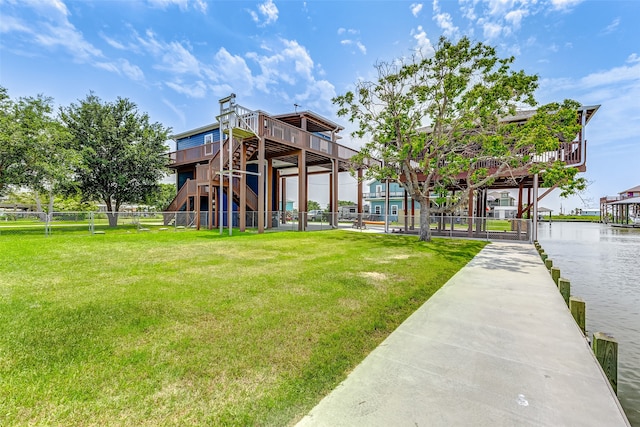 exterior space with a lawn and a water view