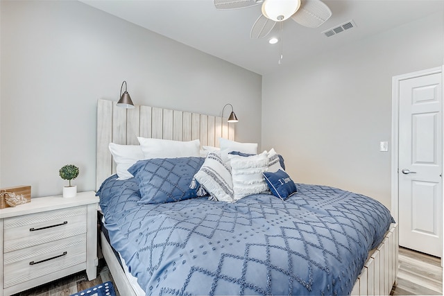 bedroom with ceiling fan and light hardwood / wood-style flooring