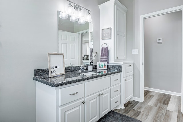 bathroom with vanity and hardwood / wood-style floors