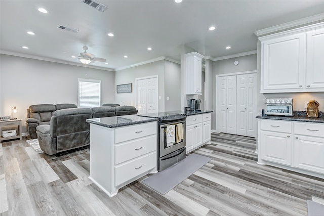 kitchen with white cabinets, ceiling fan, light wood-type flooring, and crown molding