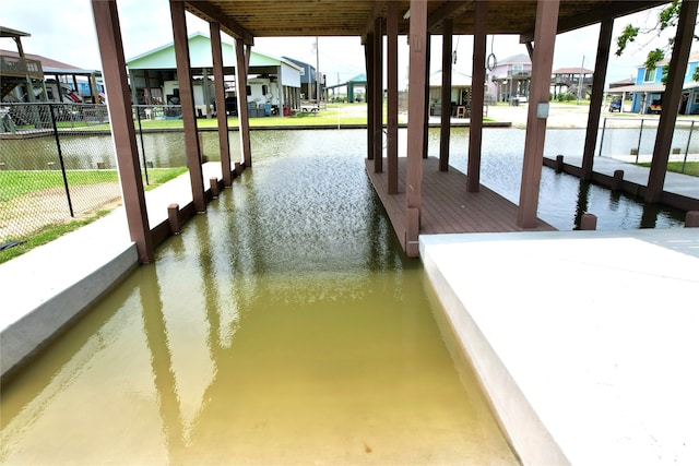 dock area with a water view