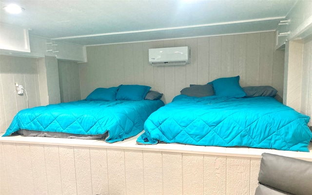 bedroom with a wall mounted air conditioner