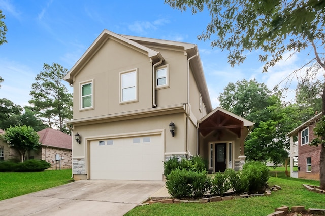 view of front property with a garage and a front yard