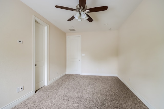 unfurnished room with carpet floors and ceiling fan