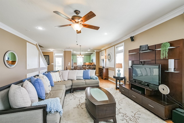 living room featuring ceiling fan with notable chandelier and ornamental molding