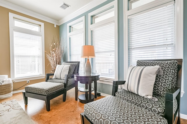 sitting room featuring ornamental molding